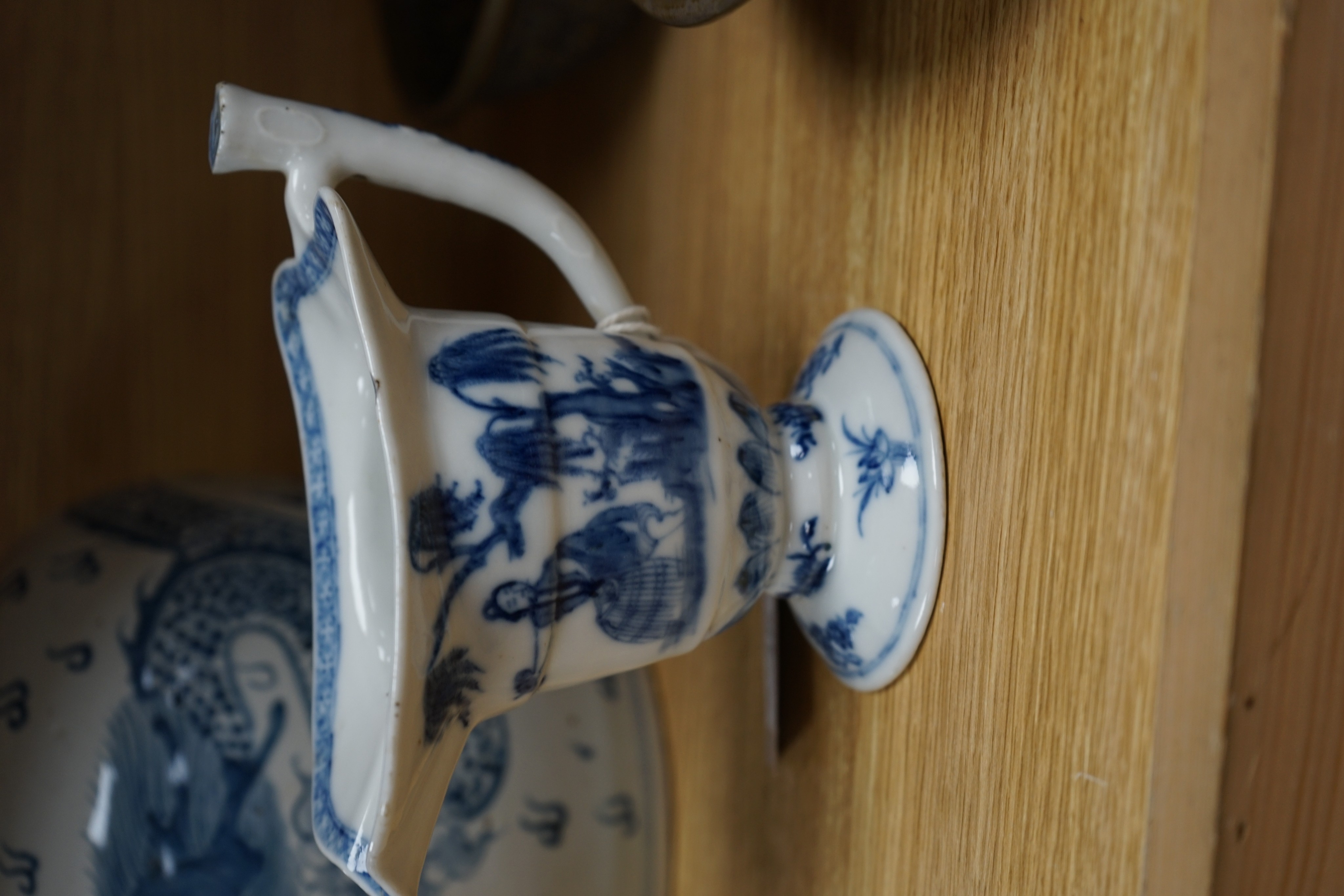 A Chinese blue and white jar, 20cm and a helmet shaped jug, 18th century and later